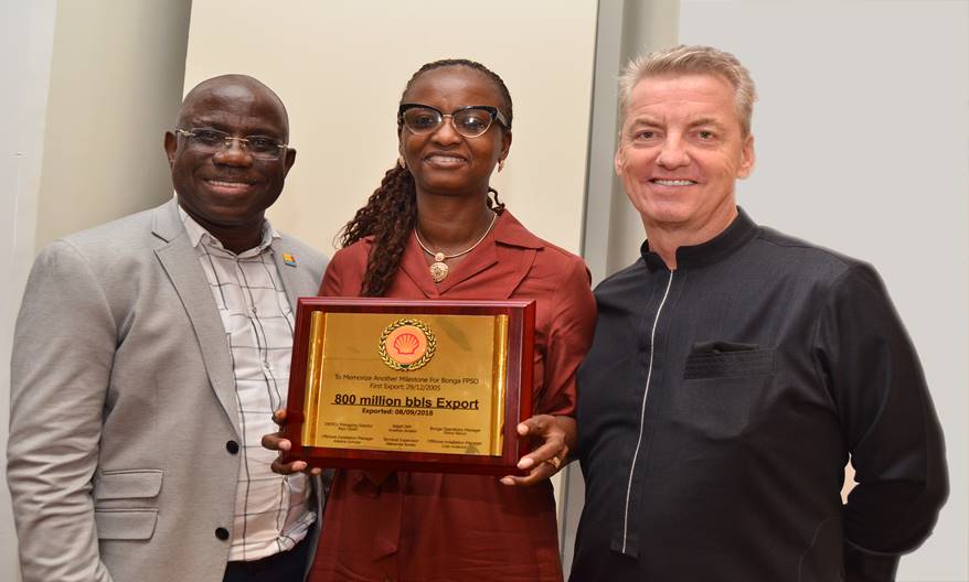 The new MD, SNEPCo, Elohor-Aiboni receiving the Shell Safety Environment and Social Performance Charter from her predecessor, Mr Bayo Ojulari